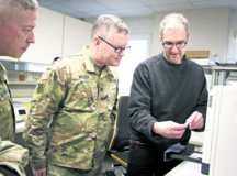 Col. Michael Weber and Command Sgt. Maj. Thurman Reynolds, Landstuhl Regional Medical Center command team, speak with Dr. Michael Koenig, technical supervisor, Virology Laboratory, to learn about LRMC’s Centers for Disease Control and Prevention 2019-Novel Coronavirus Real-Time Reverse Transcriptase Diagnostic Panel, a CDC-developed laboratory test kit to detect 2019 novel coronavirus.