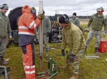 U.S. Air Force Airmen use a hydraulic tool to remove stakes from the ground during a mobile aircraft arresting system training course at Ramstein Air Base, March 11. Airmen learned how far apart to plant their stakes in order to keep the arresting system foundation secured. The training taught Airmen how to effectively build and use mobile aircraft arresting systems, which are used to rapidly decrease the speed of aircraft as they land.