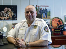 John Thompson, 86th Civil Engineer Squadron fire chief, has his photo taken at his desk, Ramstein Air Base, April 13. This year, Thompson will be inducted into the Military Firefighter Hall of Fame located at Goodfellow Air Force Base, Texas.
 Photo by Staff Sgt. Kirby Turbak