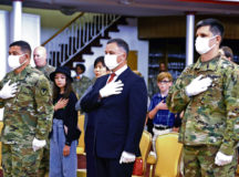 Tommy Mize, IMCOM-E director, center, stands with Col. Jason Edwards, outgoing USAG Rheinland-Pfalz commander, left, and Col. Vance Klosinski, new USAG Rheinland-Pfalz commander during the national anthem before the change of command ceremony July 22 in Kaiserslautern. Photos by Elisabeth Paque