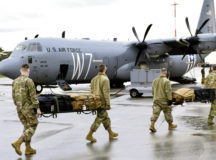 U.S. Air Force Airmen assigned to the 86th Aeromedical Evacuation Squadron carry medical equipment to a C-130J Super Hercules at Ramstein Air Base, Germany, Dec. 15, 2020. The 86th AES held a COVID-19 patient movement training using the Negatively Pressurized Conex-Lite. (U.S. Air Force photo by Senior Airman John R. Wright)