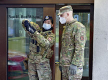 U.S. Air Force Tech. Sgt. Zita Martinez-Oros, 86th Security Forces Squadron bravo flight chief, shows Brig. Gen. Josh Olson, 86th Airlift Wing commander, ID card scanning techniques at the gates on Ramstein Air Base, Germany, Feb. 8, 2021. The 86th SFS Defenders use the Installation Access Control System (IACS) to assist in verifying access credentials for those entering the base. (U.S. Air Force photo by Senior Airman John R. Wright)