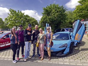 Group of people with Apex-Nürburg Ring-Taxi car