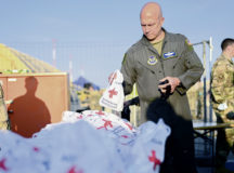 U.S. Air Force Brig. Gen. Josh Olson, 86th Airlift Wing commander, holds a comfort kit provided by the American Red Cross at Ramstein Air Base, Germany, Aug. 20, 2021. Ramstein Air Base is providing safe, temporary lodging for qualified evacuees from Afghanistan as part of Operation Allies Refuge during the next several weeks. Operation Allies Refuge is facilitating the quick, safe evacuation of U.S. citizens, Special Immigrant Visa applicants and other at-risk Afghans from Afghanistan. Qualified evacuees will receive support, such as temporary lodging, food, medical screening and treatment and more, while housed at Ramstein Air Base while preparing for onward movements to their final destinations. (U.S. Air Force photo by Senior Airman Jan K. Valle)