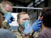 U.S. Air Force Capt. Jeffery Rueben, center, left, 52nd Medical Readiness Squadron physician assistant, and U.S. Air Force Master Sgt. Jeffrey Tremel, right, Defense Prisoner of War/Missing in Action Accounting Agency independent medical technician, provide a medical check-up for an evacuee at Ramstein Air Base, Germany, Aug. 31, 2021. Ramstein provides safe, temporary lodging for evacuees from Afghanistan as part of Operation Allies Refuge over the course of the next several weeks. Medical technicians are available around the clock to provide assistance for evacuees in case of illness or injury. (U.S. Air Force photo by Senior Airman Taylor Slater)