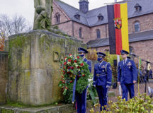 U.S. Air Force Brig. Gen. Josh Olson, 86th Airlift Wing commander, right, Staff Sgt. Joshua Irving, center, and Airman 1st Class Matthew Vaca, Ramstein Air Base Honor Guards, present a wreath on behalf of Ramstein Air Base, Germany, during the German National Day of Mourning ceremony in Ramstein-Miesenbach, Germany, Nov. 14, 2021. The National Day of Mourning is celebrated on the 33rd Sunday of each year, commemorating members of the armed forces of all nations and civilians who have died in armed conflict. (U.S. Air Force photo by Senior Airman John R. Wright)