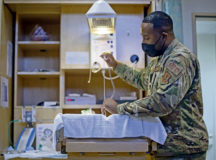 U.S. Air Force Staff Sgt. Lamaar Melvin, 86th Medical Squadron Labor and Delivery supervisor, prepares a neonatal warmer at the Landstuhl Regional Medical Center, Nov. 9, 2021. When a child is born at LRMC with health issues such as trouble breathing or is in overall poor condition, the child can be brought to the neonatal warmer where a practitioner can perform resuscitative measures, heat therapy, or assist the child’s breathing. (U.S. Air Force photo by Airman Jared Lovett)