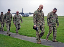 U.S. Air Force Brig. Gen. Josh Olson, second from right, 86th Airlift Wing commander, walks with Lt. Col. Kevin Coughlin, right, 424th Air Base Squadron commander, at Chievres Air Base, Belgium, Nov. 16, 2021. Olson visited Chievres for a 424 ABS immersion tour, where he visited multiple facilities such as the air traffic control tower, the firefighter department and the petroleum, oil and lubricant facility. (U.S. Air Force photo by Airman Jared Lovett)