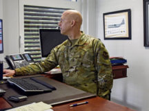 U.S. Air Force Brig. Gen. Joshua Olson, left, 86th Airlift Wing commander, and Chief Master Sgt. Charmaine Kelley, right, 86 AW command chief, congratulates Senior Airman Aaron Coffey, 424th Air Base Squadron emergency team leader, on becoming Airlifter of The Week at Ramstein Air Base, Germany, Nov. 24, 2021. Coffey was awarded AOTW for his commitment to excellence for his shop. Coffey assisted in overseeing the unit’s leave, duty schedules, additional duties, individual medical readiness and 24-hour operations. (U.S. Air Force photo by Senior Airman Andrew Alvarado)