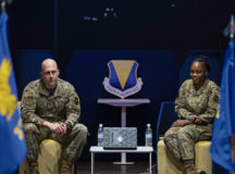 U.S. Air Force Brig. Gen. Josh Olson, left, 86th Airlift Wing commander, and Chief Master Sgt. Charmaine Kelley, 86 AW command chief, answer questions at a training event on Ramstein Air Base, Germany, Nov. 23, 2021. Olson and Kelley took the chance to address their fellow Airmen about topics such as current events, changes coming to the base, and to introduce Kelley as the new 86 AW command chief. (U.S. Air Force photo by Senior Airman Thomas Karol)