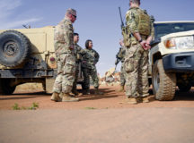 Chief Master Sgt. of the Air Force JoAnne S. Bass, center, and Chief Master Sgt. Benjamin W. Hedden, U.S. Air Forces in Europe and U.S. Air Forces Africa command chief, left, talk to Airmen during a holiday visit at Nigerien Air Base 101, Niamey, Dec. 21, 2021. During her 3-day visit, Bass gained first-hand knowledge of  how Airmen deter and defeat violent extremism in Sahel to enable a more secure, stable, and prosperous Africa. (U.S. Air Force photo by Senior Airman Ericka A. Woolever)