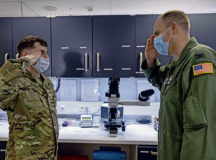 U.S. Air Force Senior Airman Dakota Moss, 86th Medical Support Squadron laboratory technician, left, salutes Col. Denny Davies, 86th Airlift Wing vice commander after being awarded Airlifter of the Week at Ramstein Air Base, Germany, March 24, 2022. While working from Lajes Field, Portugal, Moss coordinated travel for biomedical equipment repair technicians, allowing for the calibration of 20 plus pieces of medical equipment. Additionally, Moss delivered 20 vaccinations and collected samples of 98% of overdue personnel ensuring mission readiness. (U.S. Air Force photo by Senior Airman Thomas Karol)