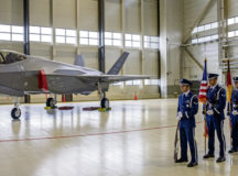 U.S. Air Force Airmen in the Ramstein honor guard await the presentation of colors next to an F-35 Lightning II aircraft assigned to the 48th Fighter Wing, Royal Air Force Lakenheath, England, during the U.S. Air Forces in Europe 80th Anniversary Ball at Ramstein Air Base, Germany, April 8, 2022. USAFE’s area of operations spans eight wings based in Europe and 83 geographically separated units. (U.S. Air Force photo by Senior Airman John R. Wright)