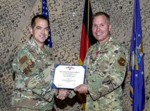 U.S. Air Force Col. Timothy J. Ritchie, outgoing 435th Air and Space Communications Group commander, right, is presented with The Legion of Merit by Col. Bryan T. Callahan, 435th Air Ground Operations Wing and 435th Air Expeditionary Wing commander, during a change of command ceremony at Ramstein Air Base, Germany, July 8, 2022. (U.S. Air Force photo by Senior Airman John R. Wright)