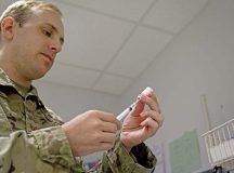 U.S. Air Force Staff Sgt. Joseph Holweger, 86th Medical Group non-commissioned officer in charge of the Immunizations Clinic, prepares a vaccine at Ramstein Air Base on Aug. 18. Holweger and the rest of his team at the immunizations Clinic on base are prepared to issue the Novavax vaccine to those interested. Photo by Senior Airman Thomas Karol