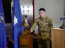 U.S. Air Force Airman 1st Class Cody Clarkin, 86th Civil Engineer Squadron fire and emergency services firefighter, conducts the ceremonial sounding of the bell at Ramstein Air Base, Germany, Sept. 9, 2022. The tolling of the bell represents the completion of the call to action and the passing of a comrade in the line of duty. (U.S. Air Force photo by Airman 1st Class Regan Spinner)