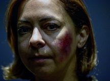 U.S. Air Force Senior Master Sgt. Iris Sanabria, 721st Aircraft Maintenance Company maintenance superintendent, showcases her makeup for the Black Eye Project at Ramstein Air Base, Germany, Oct. 26, 2022. Sanabria was one of six volunteers to take part in the Black Eye Project, a social experiment to assess public reactions to signs of abuse as part of Domestic Violence Awareness Month. (U.S. Air Force photo by Airman 1st Class Jordan Lazaro)