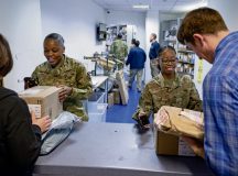 U.S. Air Force Chief Master Sgt. Charmaine N. Kelley, 86th Airlift Wing command chief, and Staff Sgt. Jalesa Reynolds, 786th Force Support Squadron postal clerk, help customers at the North Side Post Office, Ramstein Air Base, Germany, Nov. 15, 2022. The North Side Post Office depends on volunteers from the KMC to support the influx of inbound and outbound mail during the holiday season. To become a volunteer, visit https://booknow.appointment-plus.com/9rm3mcns/ and select “Postal Services” under agency and “Volunteer (Holidays)(60min)” under base services. For more information on sending out packages please contact the 786 FSS at DSN: 480-7857. (U.S. Air Force photo by Airman 1st Class Edgar Grimaldo)