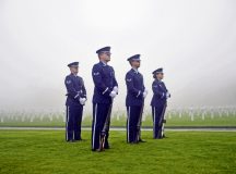 Members of the Spangdahlem Air Base honor guard team stand in formation during a Veterans Day ceremony at Henri-Chapelle American Cemetery and Memorial, Belgium, Nov. 11, 2017. The team conducted a three volley salute which historically signifies an end to hostilities for a period of time. (U.S. Air Force photo by Airman 1st Class Joshua Magbanua)