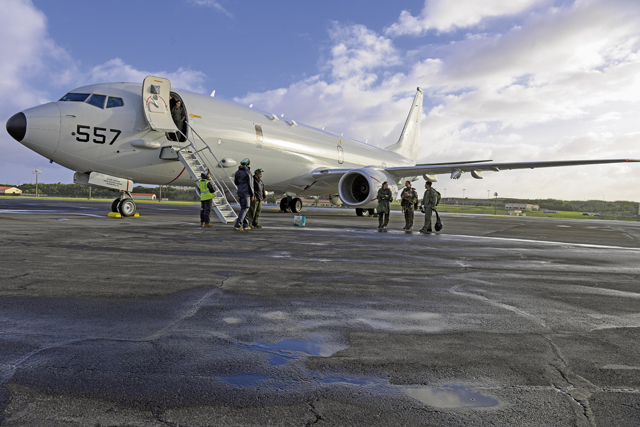 U.S. Navy VP-4 “Skinny Dragons” aircrew prepare for a mission at Lajes Field, Portugal, Oct. 19, 2022. The U.S. Navy P-8A Poseidon aircraft operate in anti-submarine warfare, anti-surface warfare, and intelligence, surveillance and reconnaissance. (U.S. Air Force photo by Airman 1st Class Lauren Jacoby)