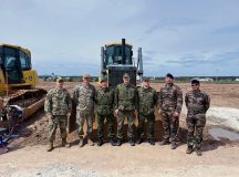 Members from headquarters USAFE-AFAFRICA pose alongside Finnish air force and French army personnel following a rapid airfield damage repair demonstration conducted by the 435th Construction and Training Squadron during a visit at Ramstein Air Base, April 27.