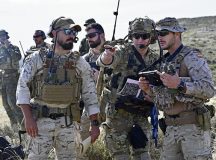 Airman 1st Class Damien LoBello, Tactical Air Control Party apprentice with Det 1 2ASOS, coordinates with Spanish Air Force Joint Terminal Attack Controllers during exercise Swift Response on a hillside near Zaragoza, Spain, May 9. The group performed close air support with A-10s from the 442d Fighter Wing and reviewed lessons learned on interoperability with their Allied partners to better sharpen their skills working together.