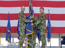 U.S. Air Force Maj. Gen. Derek France, 3rd Air Force commander, left, passes the wing flag to Col. Matthew Bartlett, 435th Air Ground Operations Wing incoming commander, right, during the 435th AGOW change of command ceremony at Ramstein Air Base, Germany, June 9, 2023. Bartlett previously served as the former 435th AGOW vice commander. (U.S. Air Force Photo by Staff Sgt. Megan M. Beatty)