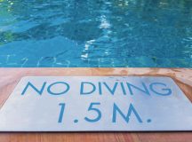 No diving sign at the swimming pool Photo by Sataporn Ponyiam/Shutterstock.com