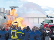 Members of the 86th Civil Engineer Squadron showcase their abilities to put out a fire on a training aircraft while hosting an open house at Ramstein Air Base, Germany, Oct. 21, 2023. The 86th CES invited the Kaiserslautern Military Community and local partners to the open house to spread awareness of fire safety while cooking this coming holiday season.  (U.S. Air Force photo by Senior Airman Andrew Bertain)