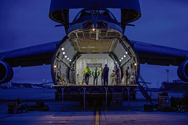 U.S. Air Force Airmen assigned to the 721st Aerial Port Squadron and Travis Air Force Base, California, load satellites onto a Lockheed C-5 Galaxy aircraft at Ramstein Air Base, Germany, Nov. 16, 2023. These satellites are equipped with high-resolution radar systems, which will provide the U.S. military with worldwide information under all-weather conditions at any time. (U.S. Air Force photo by Senior Airman Jordan Lazaro)