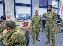 U.S. Air Force Senior Airman Aquil El-Amin, 691st Cyber Operations Squadron storage and virtualization operator, and Airman 1st Class Cristian Castro-Mendoza, 86th Airlift Wing Judge Advocates Office paralegal, tour the 691st Cyber Operations Center at Ramstein Air Base, Germany, Jan. 25, 2023. El-Amin and Castro-Mendoza swapped jobs for a day where they talked about what each of them do in the U.S. Air Force on a daily basis. (U.S. Air Force photo
by Senior Airman Thomas Karol)