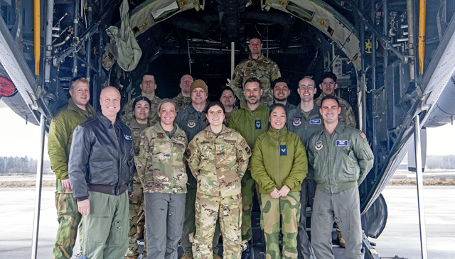 U.S. Air Force Airmen assigned to the 86th Aeromedical Evacuation Squadron and Royal Norwegian Air Force airmen assigned to the Royal Norwegian Medical Corps pose for a photo outside of a C-130J Super Hercules aircraft at Ramstein Air Base, Germany, Feb. 14, 2024. The American and Norwegian aeromedical evacuation teams met to strengthen the relationship between NATO allies.(U.S. Air Force photo by Airman 1st Class Olivia Sampson)