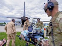 U.S. Air Force and Royal Norwegian AF members off-load a medical manikin from a C-130J Super Hercules aircraft at Papa Air Base, Hungary, May 7, 2024.  U.S. and NATO medical personnel shared techniques, knowledge and best practices during a mass casualty training that focused on aligning our skills to ensure cohesive support in future endeavors. (U.S. Air Force photo by Senior Airman Jordan Lazaro)