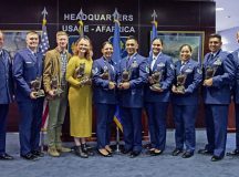 RAMSTEIN AIR BASE, Germany - Winners of the U.S. Air Forces in Europe - Air Forces Africa 12 Outstanding Airmen of the Year pose for a group photo after a ceremony at Ramstein Air Base, Germany, May 14, 2024. The winners took a tour of a C-130J Super Hercules aircraft, participated in a professional development seminar and a question and answer panel with local command chiefs. (U.S. Air Force photo by Staff Sgt. Alexandra M. Longfellow)