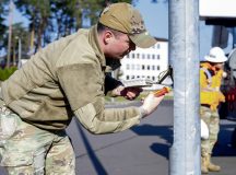 U.S. Air Force Staff Sgt. Brenden Kerwin, 786th Civil Engineer Squadron electrical systems supervisor, de-energizes a light pole at Ramstein Air Base, April 2. Due to restrictions and directives from the European Union and Germany, the fluorescent bulbs on base are being replaced with LED lights.