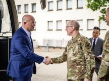 U.S. Permanent Representative to NATO, Ambassador Matthew Whitaker, is greeted by Lt. Gen. Jason Hinds, U.S. Air Forces in Europe – Air Forces Africa deputy commander at Ramstein Air Base, Germany, July 30, 2025. By engaging with senior U.S. military leaders, the ambassador gained a first-hand understanding of how integration and interoperability of U.S. and NATO ally air and space forces provides benefits for both the U.S. and NATO nations. (U.S. Air Force photo by Airman 1 st Class Dylan Myers)