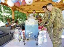 U.S. service members and civilian personnel assigned to Ramstein Air Base, attend the 15th anniversary event of the Deployment Transition Center at Ramstein AB, Germany, Aug. 7, 2025. The DTC offers services to all U.S. service members within the Kaiserslautern Military Community who are returning back home from a deployment.  (U.S. Air Force Photo by Senior Airman Renan Arredondo)