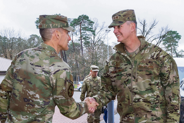 U.S. Air Force Brig. Gen. Stephen P. Snelson, U.S. Air Forces in Europe and Air Forces Africa deputy commander, greets U.S. Air Force Gen. Alexus G. Grynkewich, U.S. European Command commander, during a visit to Ramstein Air Base, Nov. 25. Photo by Senior Airman Renan Arredondo