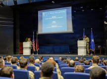 U.S. Air Force Brig. Gen. Adrienne L. Williams, 86th Airlift Wing commander, and Chief Master Sgt. Clifford L. Lawton, 86th AW command chief, discuss the wing’s strategic guidance during an all call at Ramstein Air Base, Germany, Jan. 14, 2026. During the all call, 86th AW leadership highlighted how the wing's guidance aligns with evolving operational priorities. (U.S. Air Force photo by Airman 1st Class Rebecca Harima)