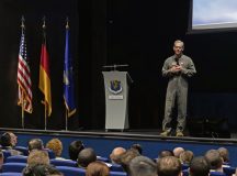 U.S. Air Force Chief of Staff Gen. Ken Wilsbach gives remarks on stage during a visit at Ramstein Air Base, Germany, Dec. 23, 2025. This visit offered Airmen across Team Ramstein a first look at the new leadership team and their priorities. (U.S. Air Force photo by Airman 1st Class Rebecca Harima)