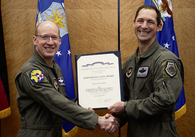 U.S. Air Force Lt. Gen. Jason T. Hinds, U.S. Air Forces in Europe – Air Forces Africa commander, presents the Meritorious Unit Award to Brig. Gen. Jack Arthaud, 48th Fighter Wing commander, during the USAFE-AFAFRICA 2026 Wing Leadership Conference at Ramstein Air Base, Jan. 22. General Arthaud accepted the award on behalf of the 48th Fighter Wing for the organization’s meritorious conduct in direct support of military operations between January 1, 2023, and December 31, 2024.