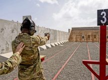 A U.S. Air Force Airman assigned to the 776th Expeditionary Air Base Squadron fires a handgun at the newly opened on-site small arms range at Chabelley Airfield, Djibouti, Jan. 31, 2026. Chabelley Airfield marked a major operational milestone with the opening of its small arms range, a $1.6 million project that significantly expands on-site training capacity and operational flexibility for U.S. and partner forces. (U.S. Air Force photo by Staff Sgt. Christian Silvera)