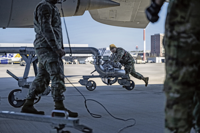 Airman 1st Class Gavan Ko, 86th Logistics Readiness Squadron fuels distributor, pushes a pantograph at Ramstein Air Base, Germany, March 4, 2026. Petroleum, Oils, and Lubricants Airmen manage millions of gallons of stored fuel to sustain daily flight operations and maintain mission readiness across multiple wings and combatant commands. (U.S. Air Force photo by Airman 1st Class Dylan Myers)