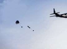 A U.S. Air Force C-130J Super Hercules cargo aircraft drops two bundles of humanitarian supplies during a humanitarian mission known as the “Chabelley Care Drop” at Chabelley Airfield, Djibouti, Feb. 21, 2026. The event showcased how Chabelley Airfield enables reliable and secure aviation support for missions across the region. (U.S. Air Force photo by Staff Sgt. Christian Silvera)