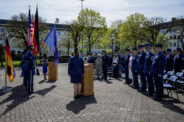 Airmen assigned to the 86th Airlift Wing and the 76th Airlift Squadron stand at attention during the presenting of colors for the 30th annual remembrance ceremony in honor of the fallen crew members of Implementation Force-21 Ramstein Air Base, Germany, April 9, 2026. The April 3, 1996 accident prompted sweeping Air Force safety improvements that fundamentally changed the way military aircraft operate, establishing new standards and requirements that have since protected countless aircrew and passengers on missions around the world. (U.S. Air Force photo by Senior Airman Trevor Calvert)