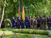 U.S. and German Kaiserslautern Military Community members bow their heads in silence during the Kindergraves Memorial Ceremony in Kaiserslautern, Germany, May 16, 2026. The Kaiserslautern Kindergraves Memorial Foundation, which is co-chaired by the German-American Club Kaiserslautern and the Ramstein Area Chiefs' Group, was established in 1986 to maintain the memorial site, organize remembrance ceremonies and address family inquiries. (U.S. Air Force photo by Staff Sgt. Sabrina Fuller-Judd)
