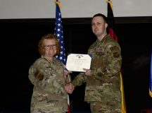 U.S. Air Force Staff Sgt. Andrew Erixon, right, 86th Security Forces Squadron deployment manager, receives a Purple Heart medal from U.S. Air Force Brig. Gen. Adrienne L. Williams, 86th Airlift Wing commander, during a ceremony at Ramstein Air Base, Germany, May 13, 2026. The Purple Heart is the oldest U.S. military decoration still awarded to service members, presented to those wounded or killed in action. (U.S. Air Force photo by Senior Airman Trevor Calvert)