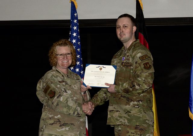 U.S. Air Force Staff Sgt. Andrew Erixon, right, 86th Security Forces Squadron deployment manager, receives a Purple Heart medal from U.S. Air Force Brig. Gen. Adrienne L. Williams, 86th Airlift Wing commander, during a ceremony at Ramstein Air Base, Germany, May 13, 2026. The Purple Heart is the oldest U.S. military decoration still awarded to service members, presented to those wounded or killed in action. (U.S. Air Force photo by Senior Airman Trevor Calvert)