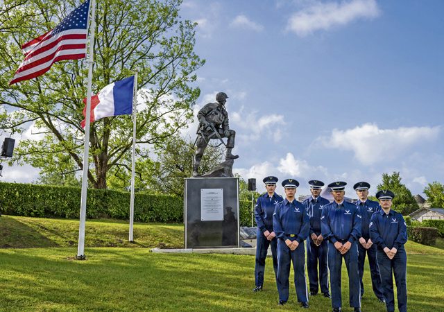 Ramstein Air Base Honor Guard team pose for a photo prior to the 8th Air Force ceremony in commemoration of D-Day 82 at Sainte-Mére-Église, France, June 4, 2026. The team honored those of the 8th Air Force who played a critical role in weakening German air power and infrastructure through bombing. On D-Day, 8th AF bombers targeted coastal defenses. Today, we reflect on the courage and sacrifice of those who stood united against oppression, a powerful reminder that unity and determination can overcome even the greatest challenges. (U.S. Air Force photo by Staff Sgt. Sabrina Fuller-Judd)