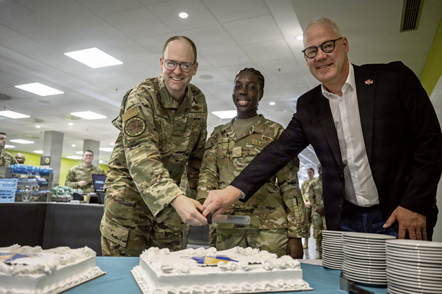 U.S. Air Force Col. Denny R. Davies, left, 86th Airlift Wing commander, Ralf Hechler, right, Ramstein-Miesenbach mayor, and Airman Basic Paola Kpandja, 86th Maintenance Squadron C-130J Super Hercules avionics apprentice, cut a birthday cake during the 86th AW’s 78th birthday celebration at the Rheinland Inn Dining Facility on Ramstein Air Base, Germany, July 1, 2026. The ceremony commemorated the wing’s activation on July 1, 1948, and recognized nearly eight decades of supporting air mobility, humanitarian assistance and global operations around Europe and beyond. (U.S. Air Force photo by Airman 1st Class Rebecca Harima)